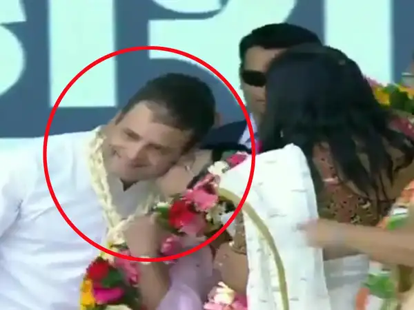 gujarat woman party worker kisses congress president rahul gandhi during rally in valsad