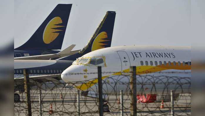 (FILES) In this file photo taken on March 25, 2019, Jet Airways aircraft are seen parked on the tarmac at Chattrapati Shivaji International Airport in Mumbai. - India’s debt-stricken Jet Airways grounded all of its operations on April 17 after failing to secure emergency funding from lenders, the carrier said in a statement. (Photo by PUNIT PARANJPE / AFP)