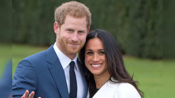 LONDON, ENGLAND - NOVEMBER 27:  Prince Harry and Meghan Markle, wearing a white belted coat by Canadian brand Line The Label, attend a photocall in the Sunken Gardens at Kensington Palace following the announcement of their engagement on November 27, 2017 in London,  England. (Photo by Anwar Hussein/Getty Images) *** Local Caption *** Prince Harry;Meghan Markle