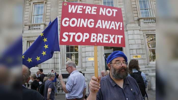 An anti Brexit protestor stands in front of the Cabinet office in London, Friday, Aug. 30, 2019. A legal bid in a Scottish court to immediately halt the British government's plan to suspend Parliament has failed Friday, but a full court hearing is now scheduled for next week.(AP Photo/Frank Augstein)