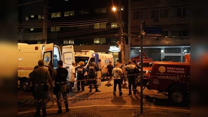 Rio de Janeiro: Personnel stand outside the hospital where a fire forced staff to evacuate in Rio de Janeiro, Brazil,Thursday, Sept. 12, 2019. The fire forced staff to hastily evacuate patients and temporarily settle some on sheets and mattresses in the street while firefighters fought the blaze. AP/PTI(AP9_13_2019_000021A)