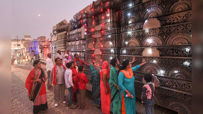 Ayodhya: People during a visit to the Shri Ram Janmbhoomi Nyas Karyashaala (workshop), a day after the Supreme Court's verdict on the Ayodhya case, in Ayodhya, Sunday, Nov. 10, 2019. The apex court has backed the construction of a Ram temple by a trust at the disputed site. (PTI Photo/Nand Kumar)  (PTI11_10_2019_000158B)