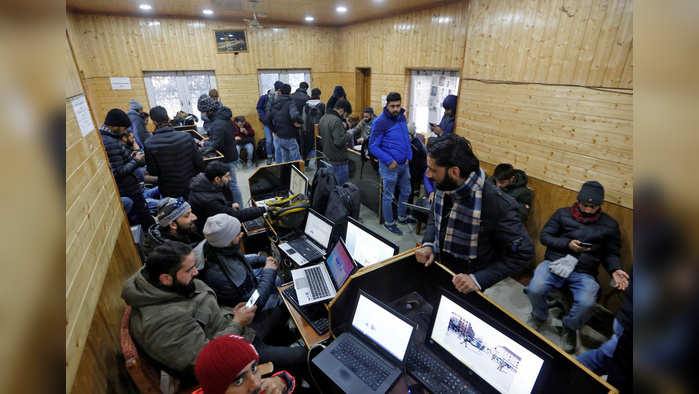 Journalists use the internet as they work inside a government-run media centre in Srinagar January 10, 2020. REUTERS/Danish Ismail