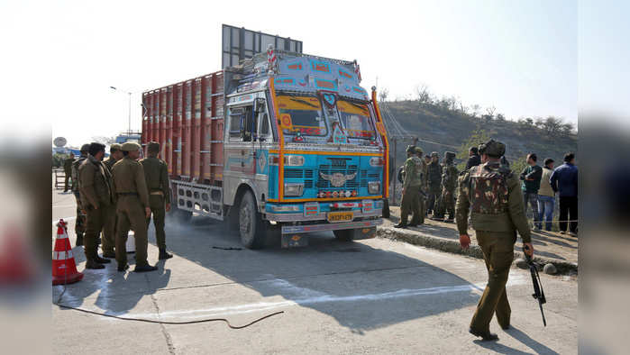 Indian security forces stand around a truck which was used by suspected militants, at the site of a gun battle at Nagrota, on the outskirts of Jammu, January 31, 2020. REUTERS/Mukesh Gupta