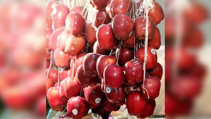 Shining Apples at Russell market.in Bengaluru. Fruits have no shield from chemical interference, as the mangoes are made to get ripened in dark godowns amidst the calcium carbonate sachets. Or like the water melons that get injected with a chemical called Erythrosine, to make the fruit look more red shilling apples which are covered with wax coatings. Most of the artificial ripening activities are rampant in godowns by the middle men