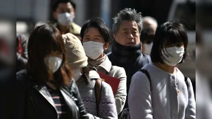 People wait outside the Yokohama district court on March 16, 2020, before the expected verdict of Satoshi Uematsu, accused of the 2016 murder 19 disabled people at a care facility in the town of Sagamihara. - Uematsu, a former employee at the facility, does not dispute his involvement in the grisly stabbing rampage that shocked Japan where violent crime is rare. He faces the death penalty if convicted. (Photo by Philip FONG / AFP)