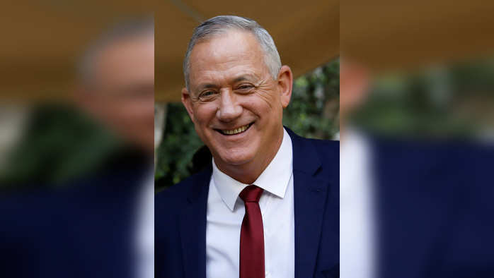 FILE PHOTO: Benny Gantz, head of Blue and White party, smiles after giving a statement to the media in Ramat Gan, Israel March 1, 2020. REUTERS/Nir Elias/ File Photo