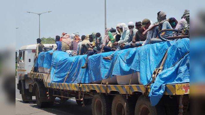 ???????? ??????????? ???????? ??????.  Bhubaneswar: Migrants board a truck to travel to their native places, during the ongoing nationwide COVID-19 lockdown, in Bhubaneswar, Friday, May 15, 2020. (PTI Photo)                         (PTI15-05-2020_000156B)