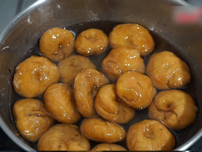 dip badusha in sugar syrup dip badusha in sugar syrup