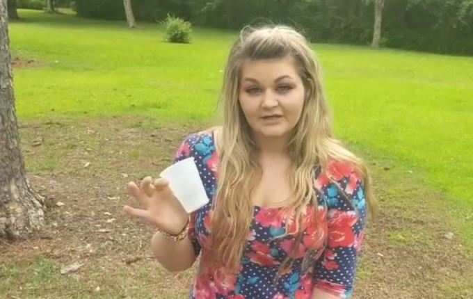 Young woman drinking dog urine