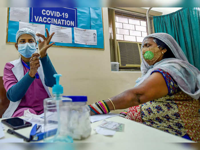 New Delhi: A medic prepares to administer the first dose of Covaxin vaccine to a...