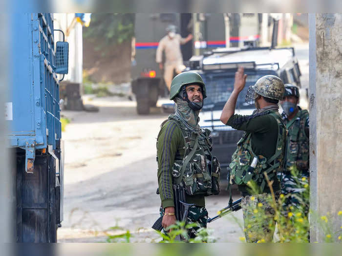 Pulwama: Security personnel during an encounter with militants at Rajpora in Pul...