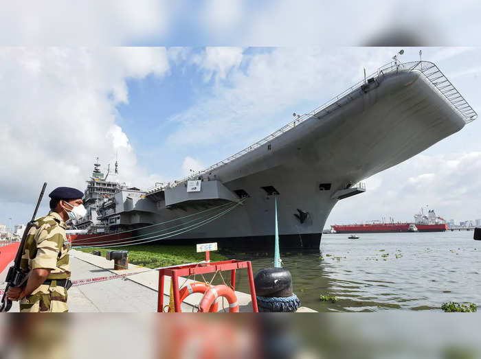 Kochi: A security personnel guards near the INS Vikrant, an indigenous aircraft ...