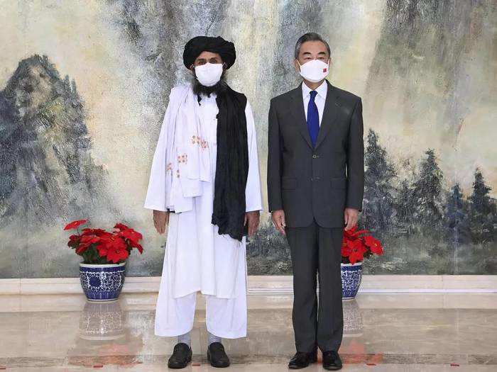 Taliban co-founder Mullah Abdul Ghani Baradar and Chinese Foreign Minister Wang Yi