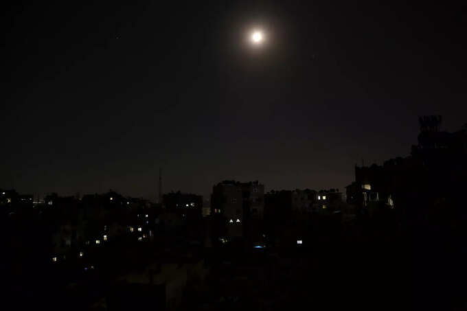 A view shows unlit residential buildings during a power cut in Damascus A view shows unlit residential buildings during a power cut in Damascus