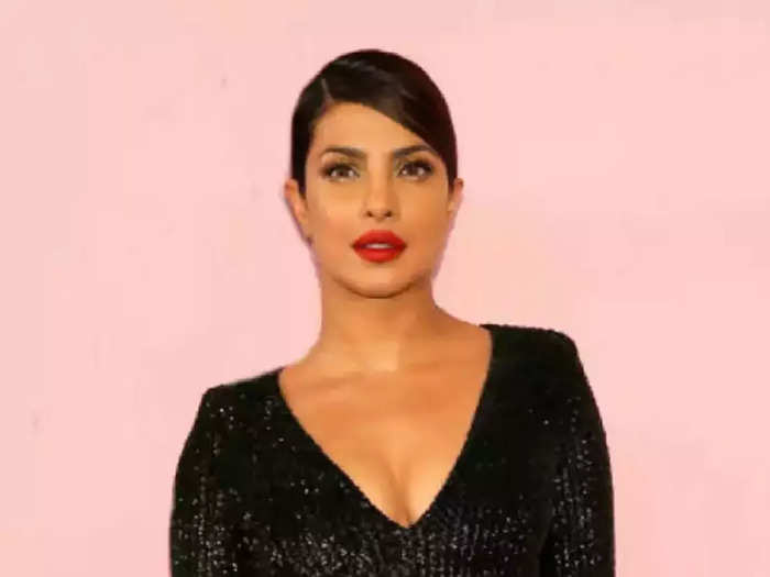 actress priyanka chopra wore off shoulder silver sequinned gown for the matrix resurrections grand premiere see her sexy look