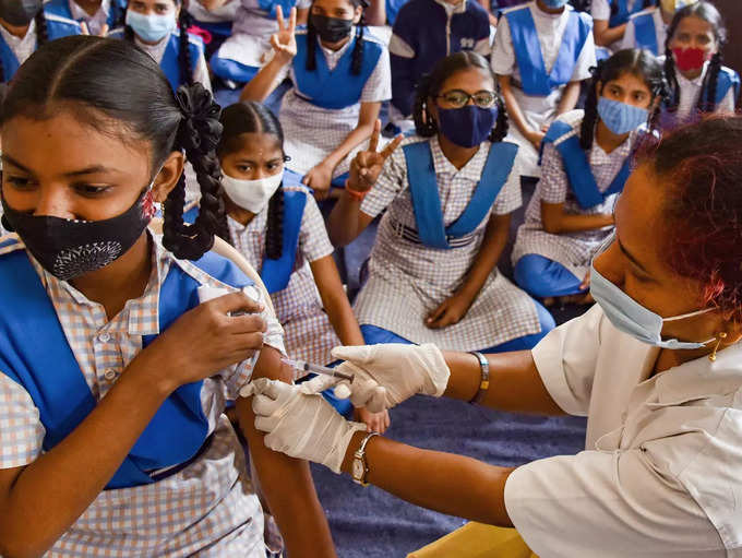 Hyderabad: School children receive COVID-19 vaccine dose, at a government school...