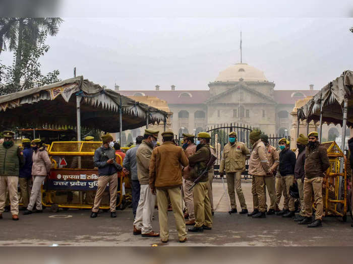 Prayagraj: Policemen stand outside the closed Allahabad High Court after 8 judge...