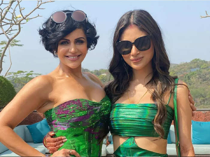 mouni roy looks like a diva in green cut out dress while having sindoor in her hair and shakha pola in hands