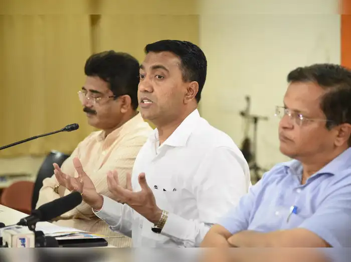 Panaji: Goa CM Pramod Sawant (C) with Goa BJP President Sadanand Shet Tanavade (...