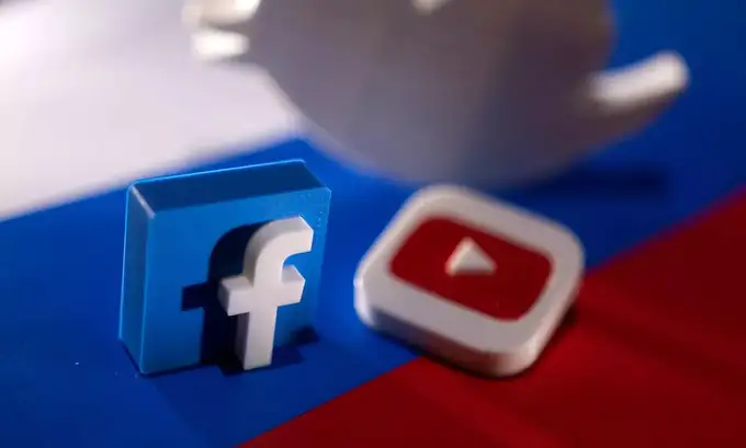 Illustration shows Twitter, Facebook and Youtube logos and Russian flag