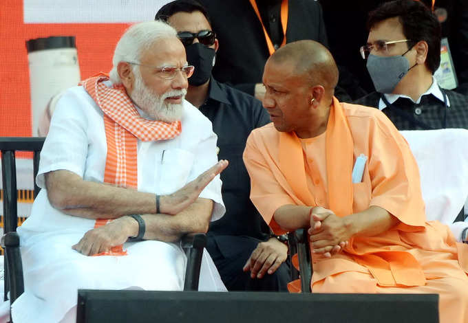 Lucknow: Prime Minister Narendra Modi with BJP leader Yogi Adityanath, during th...