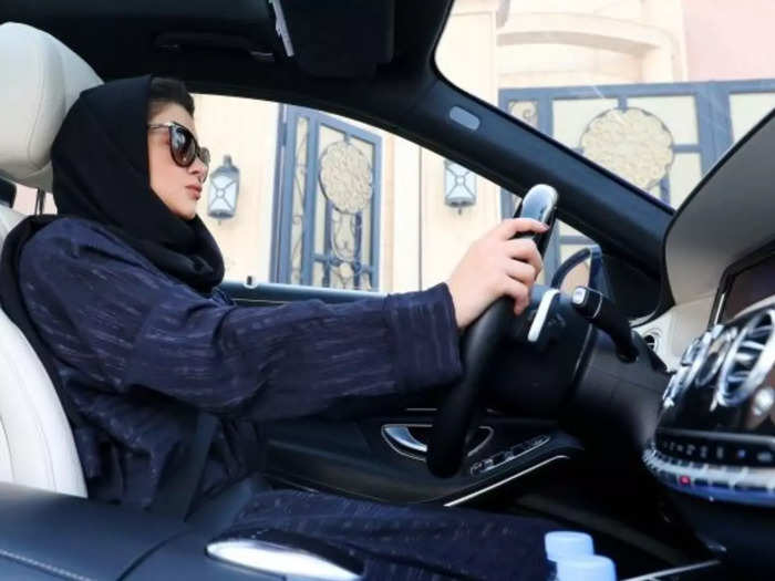 women driving car