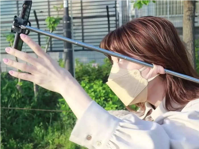 ayumi takada the real life elastigirl from tokyo can hol selfie sticks umbrella with stretchy earlobes