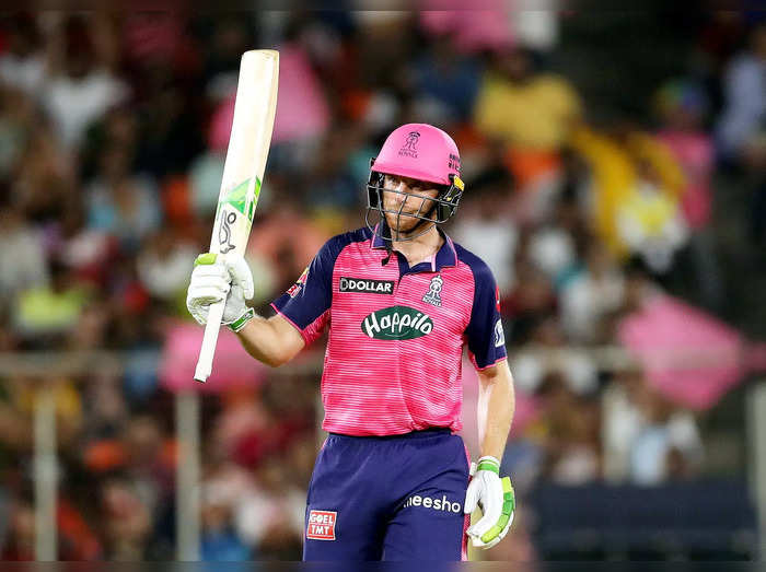 Ahmedabad: Jos Buttler of Rajasthan Royals celebrates his half century during th...