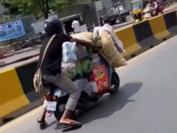Man Riding Scooty Dangerously