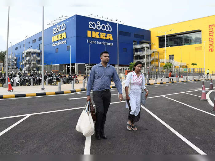 Shoppers walk outside IKEA&#39;s new store in Bengaluru