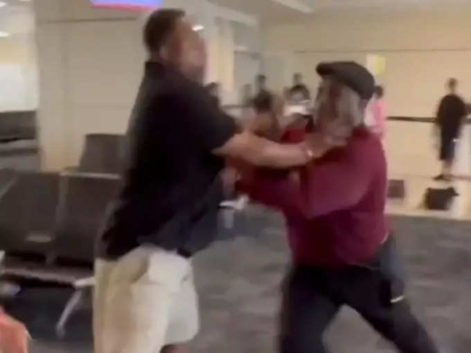 man fighting in airport with woman