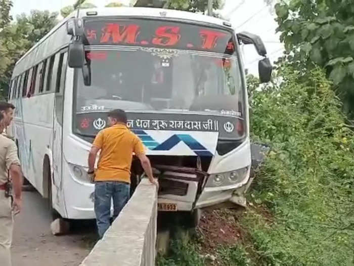 bus hangs in canal