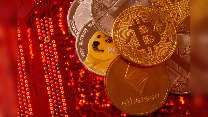 FILE PHOTO: Representations of cryptocurrencies Bitcoin, Ethereum, DogeCoin, Ripple, Litecoin are placed on PC motherboard in this illustration taken