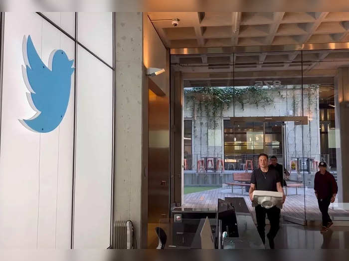 Elon Musk entering the Twitter office