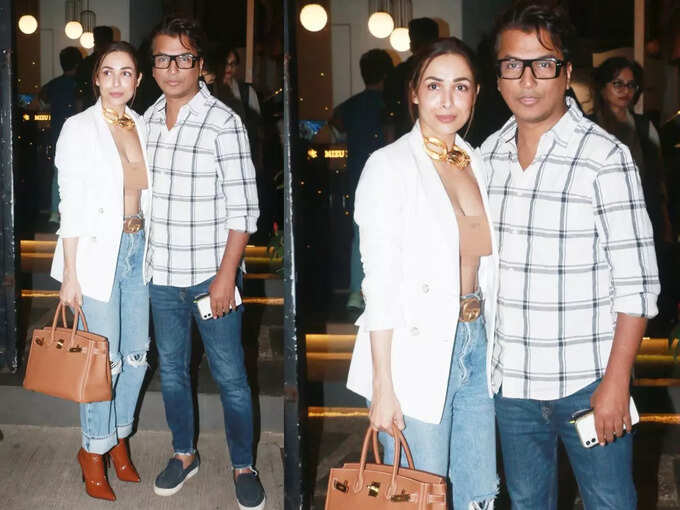 Malaika looks glamorous with a short tube top, a big chain around her neck, a dinner date not with Arjun but with 'Ya' special friend | Hits Times 95468178 | Hits Times
