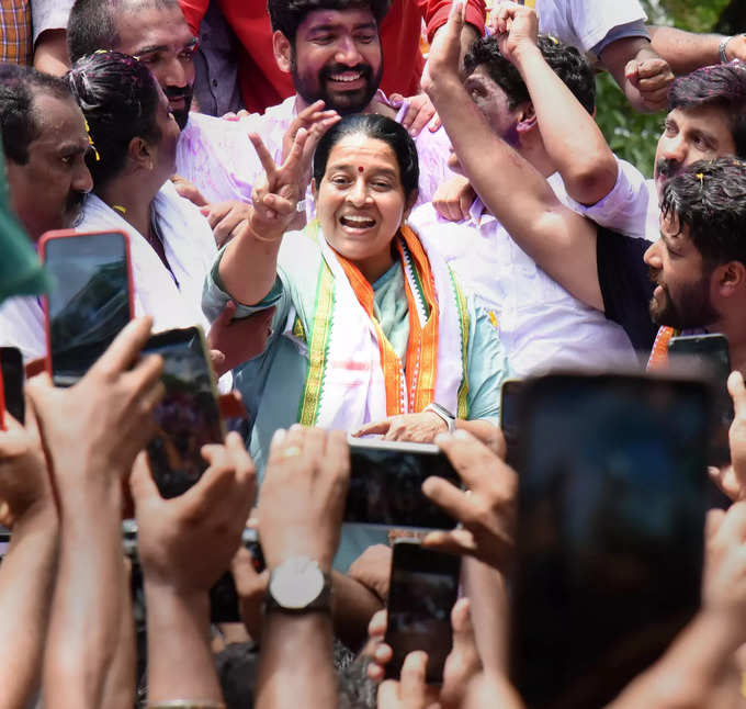 Kochi: UDF candidate Uma Thomas flashes the victory sign as she celebrates her v...